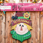 a wooden sign with a picture of a scarecrow on it