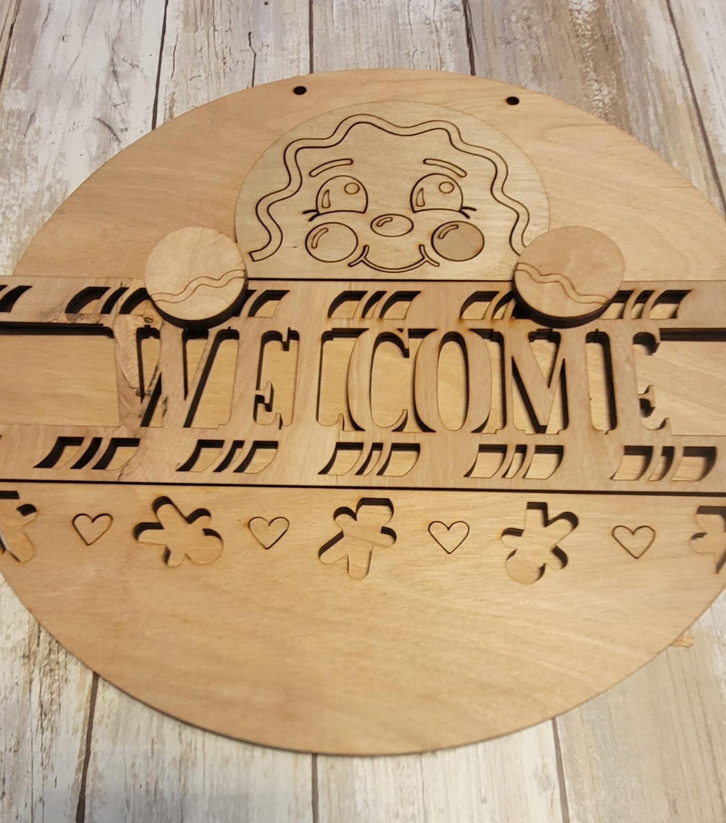 a wooden sign that says welcome on it