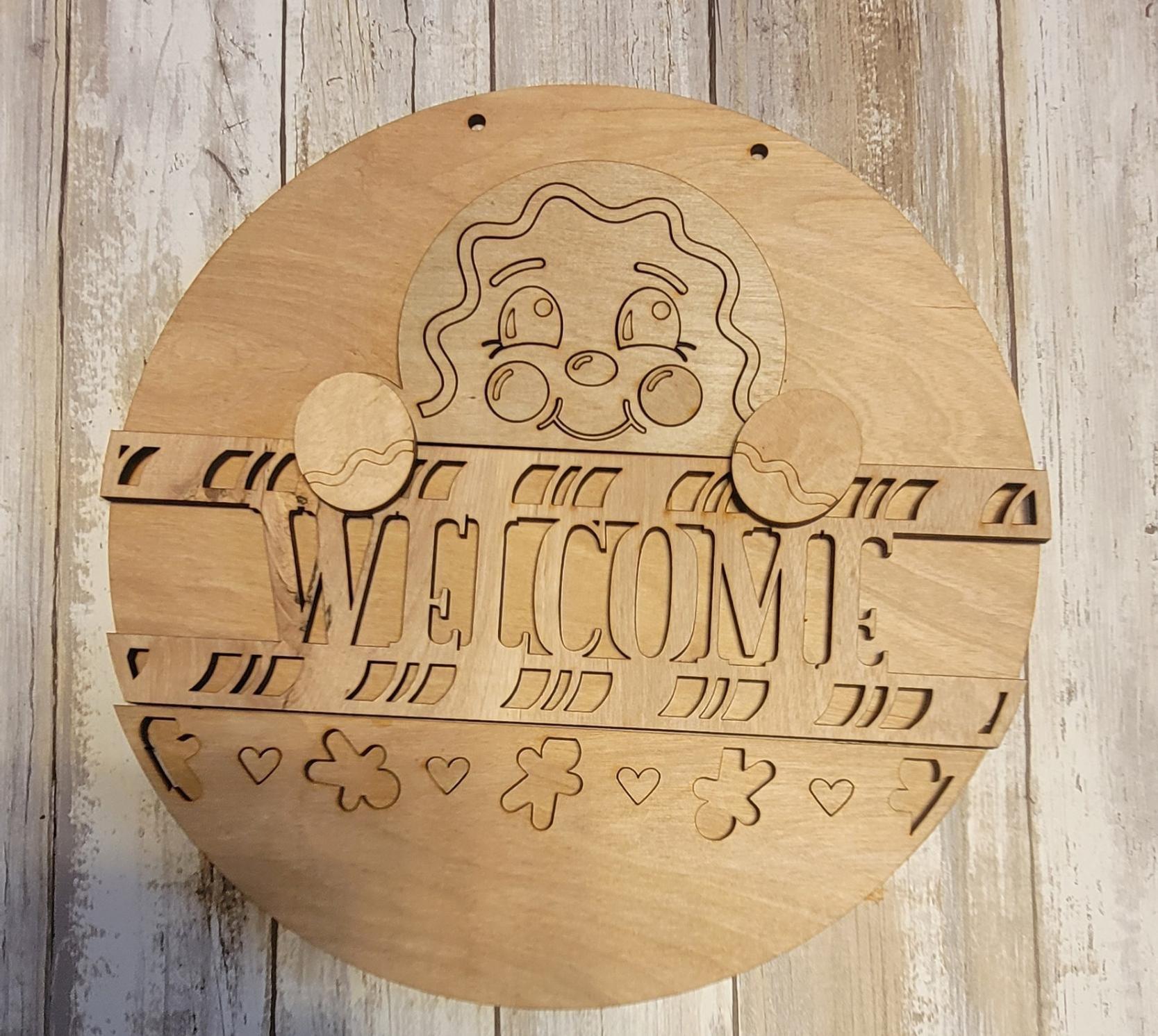 a wooden sign that says welcome on it