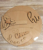 a wooden plaque with a picture of a boat on it