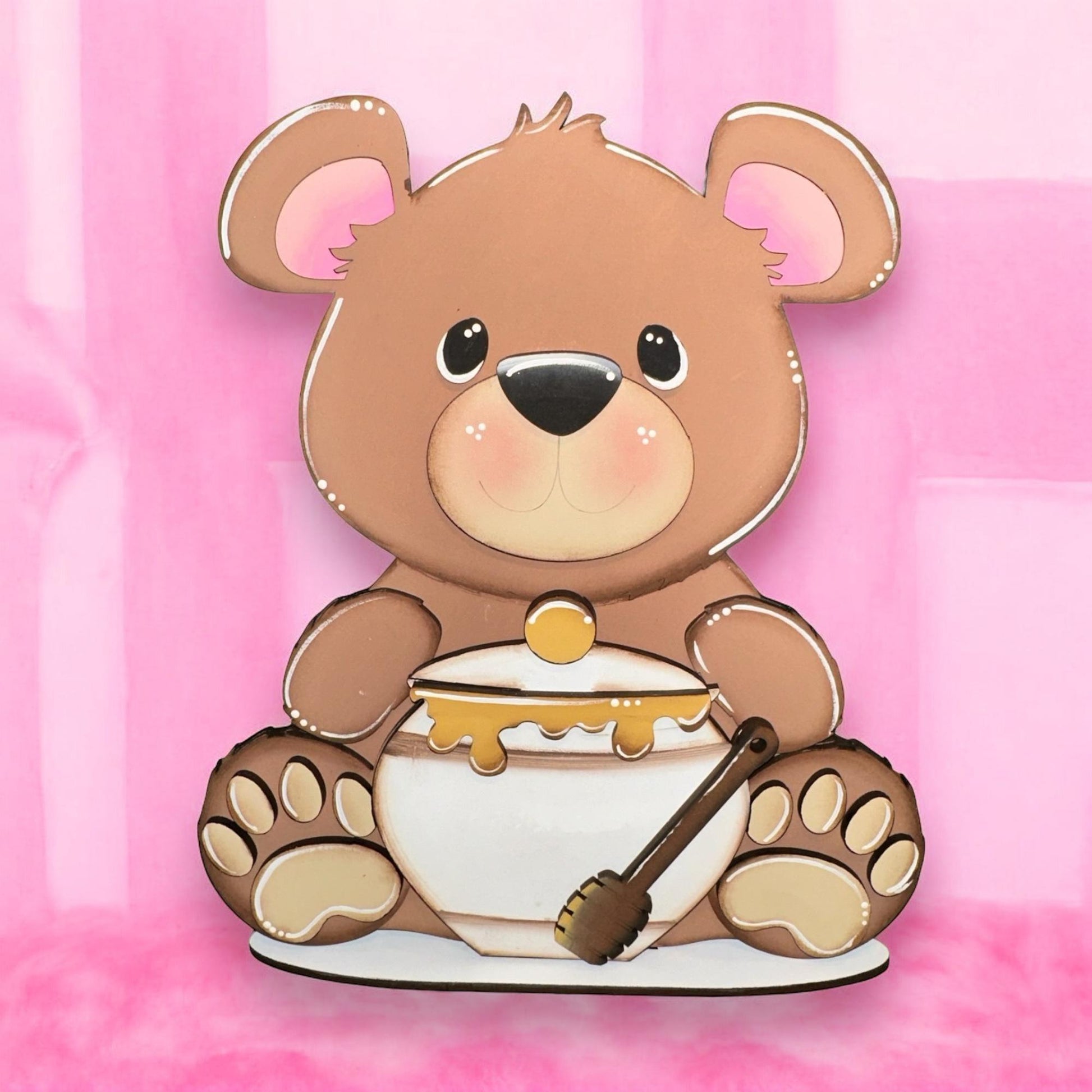 a brown teddy bear sitting on top of a white bowl