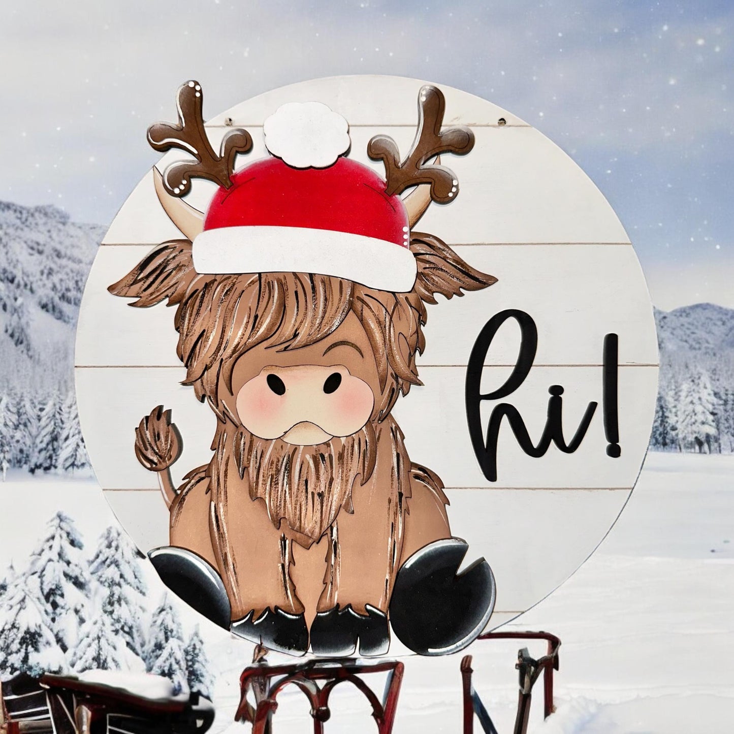 a wooden sign with a picture of a reindeer wearing a santa hat