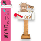 a wooden mailbox with a cow sticking out of it