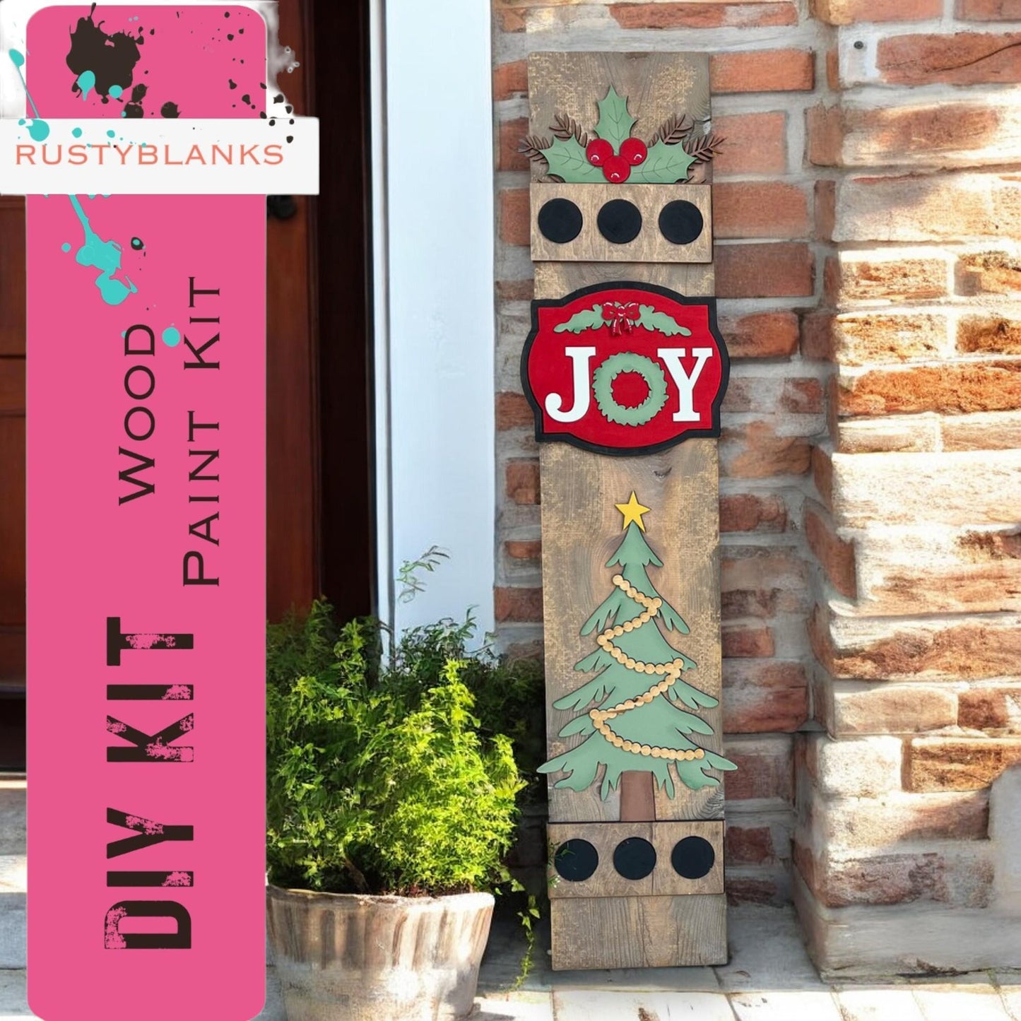 a wooden sign that says joy next to a potted plant