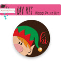 a wooden button with a elf's head on it