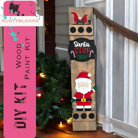 a wooden sign with a santa clause on it