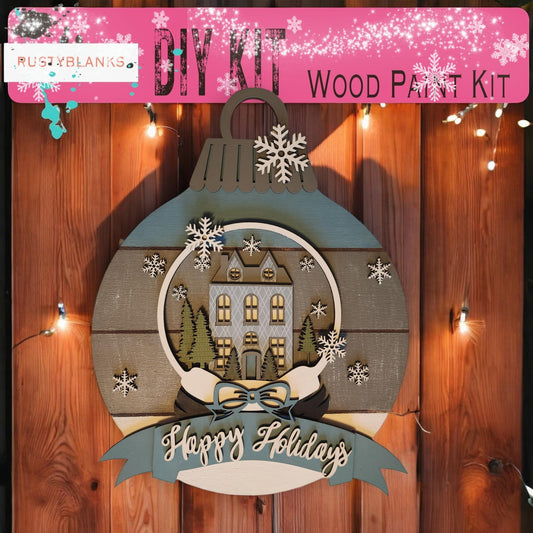 a wooden christmas ornament hanging on a wooden fence