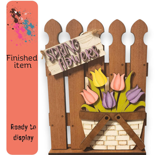 a picture of a wooden fence with flowers in it