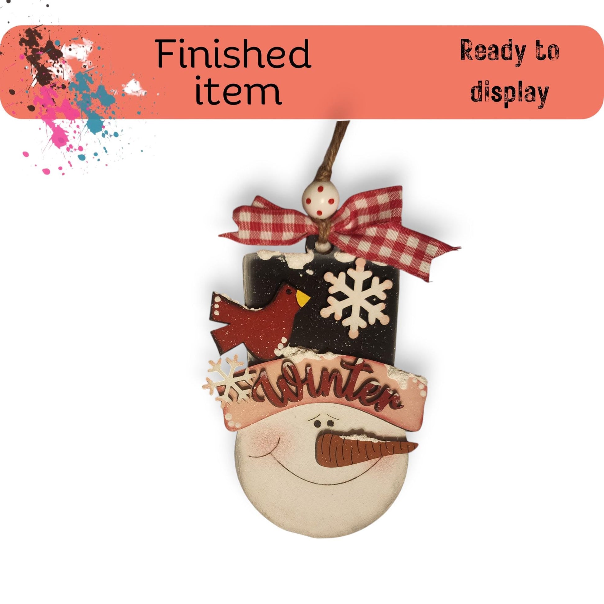 a christmas ornament with a snowman on it