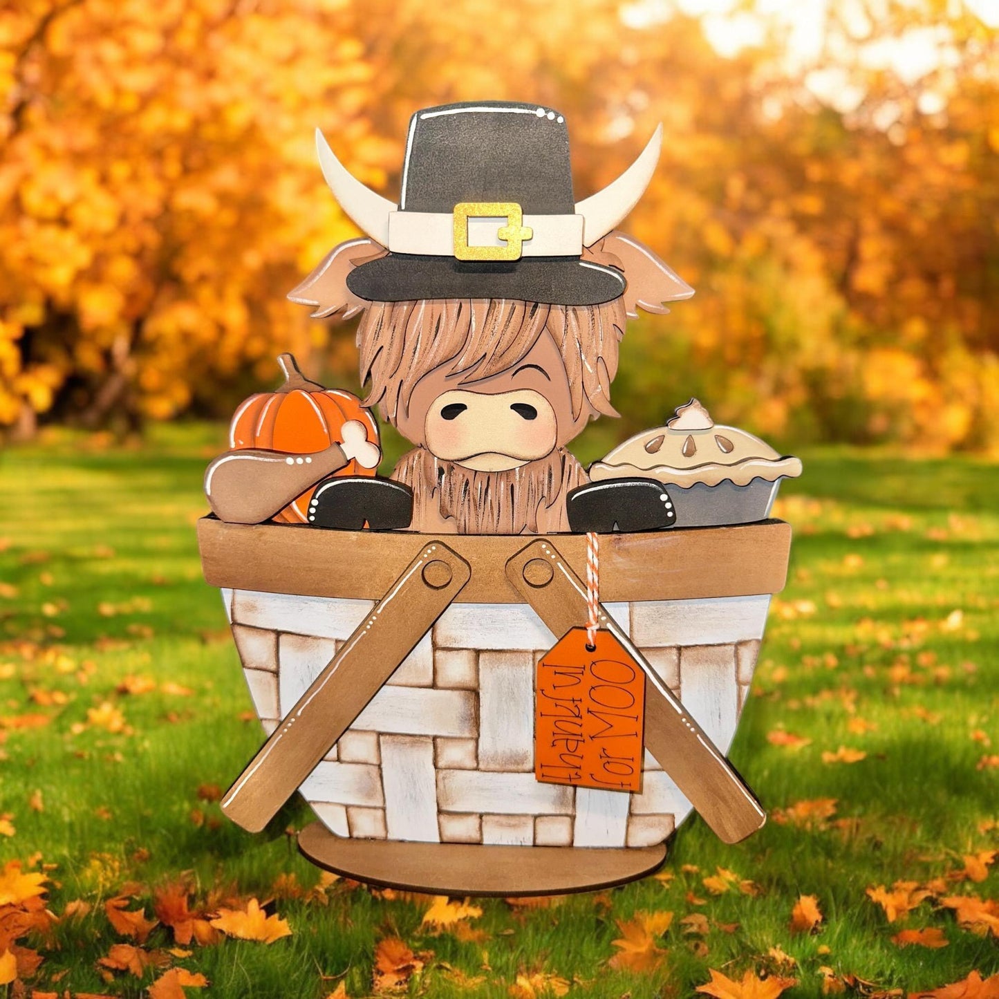 a paper cut out of a scarecrow in a basket