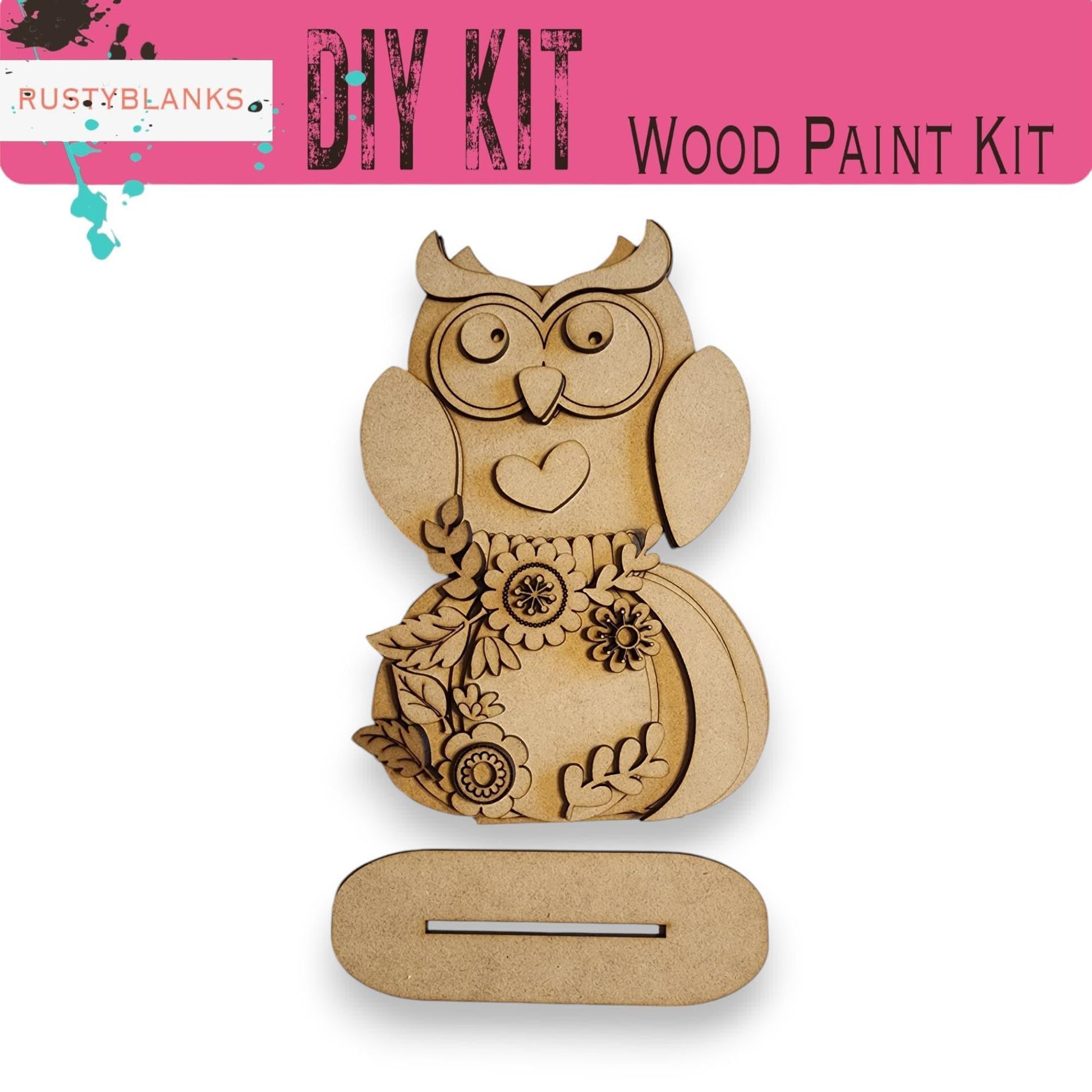 a wooden cutout of an owl with flowers