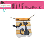 a picture of a wooden paint kit with a cat and a bat