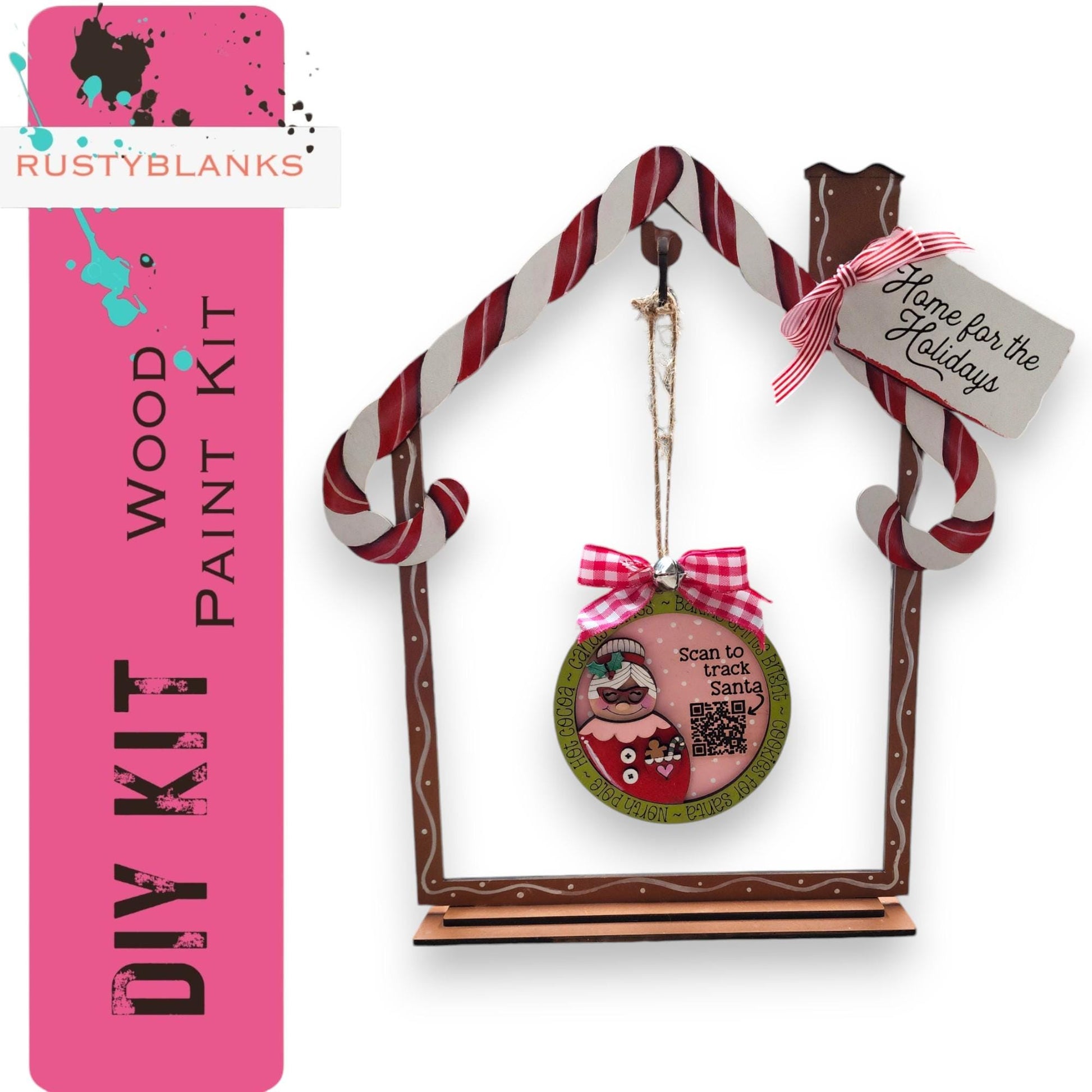 a birdhouse ornament with a pink ribbon around it