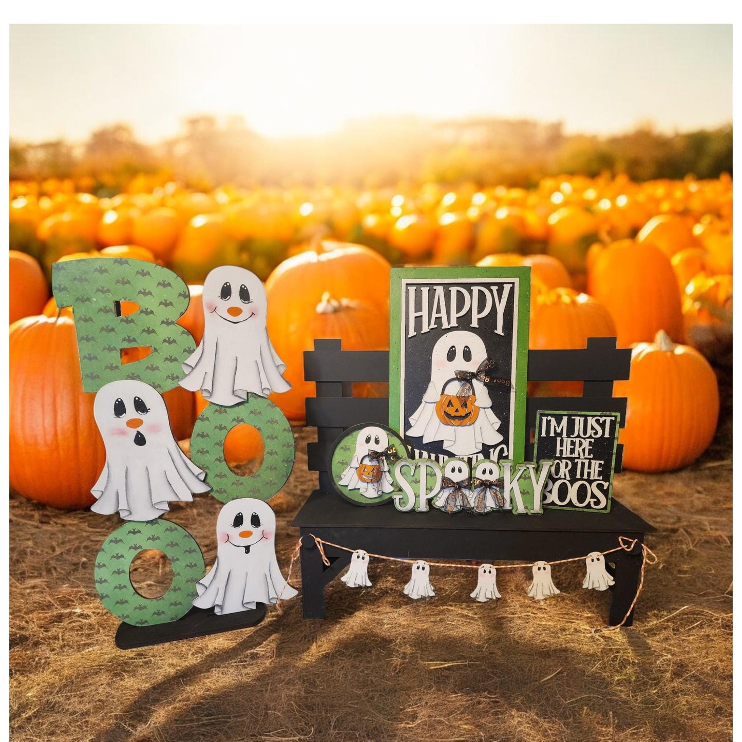 a couple of halloween decorations sitting on top of a field