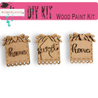a set of three wooden tags with words on them