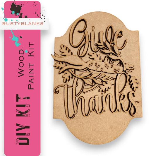 a wooden plaque with the words give thanks on it