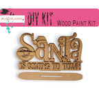 a wooden sign that says santa is coming to town