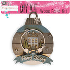 a wooden ornament with a house on it