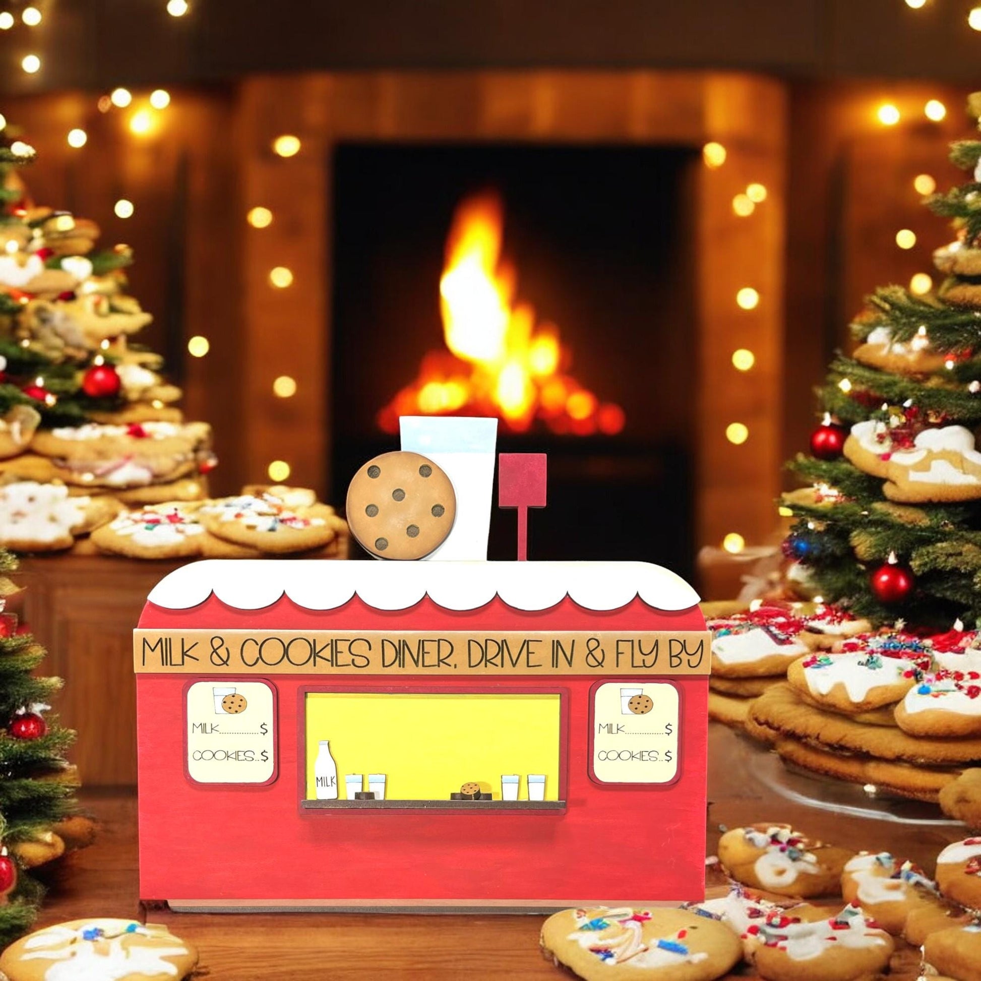 a box of cookies sits in front of a christmas tree