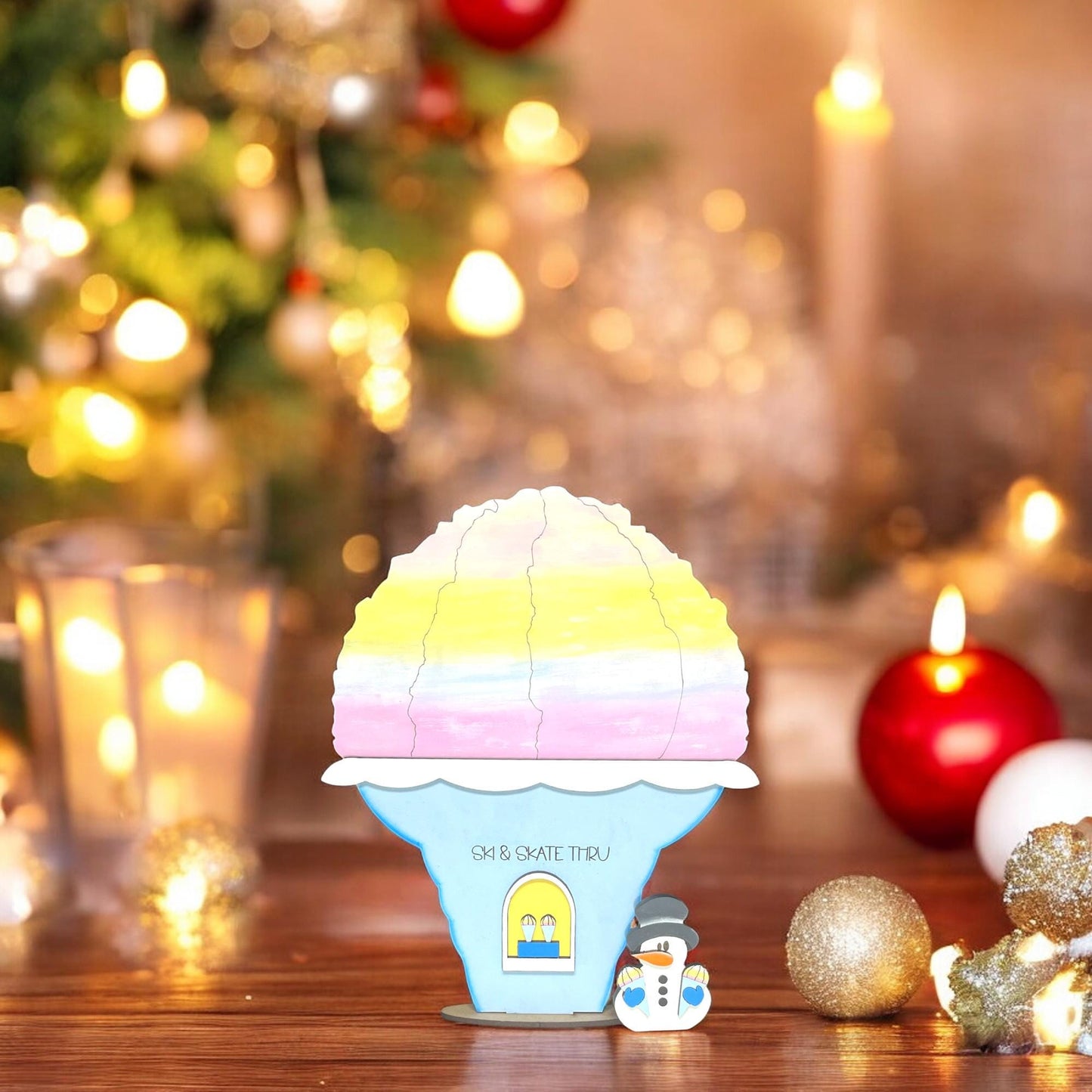 a toy ice cream machine sitting on top of a wooden table