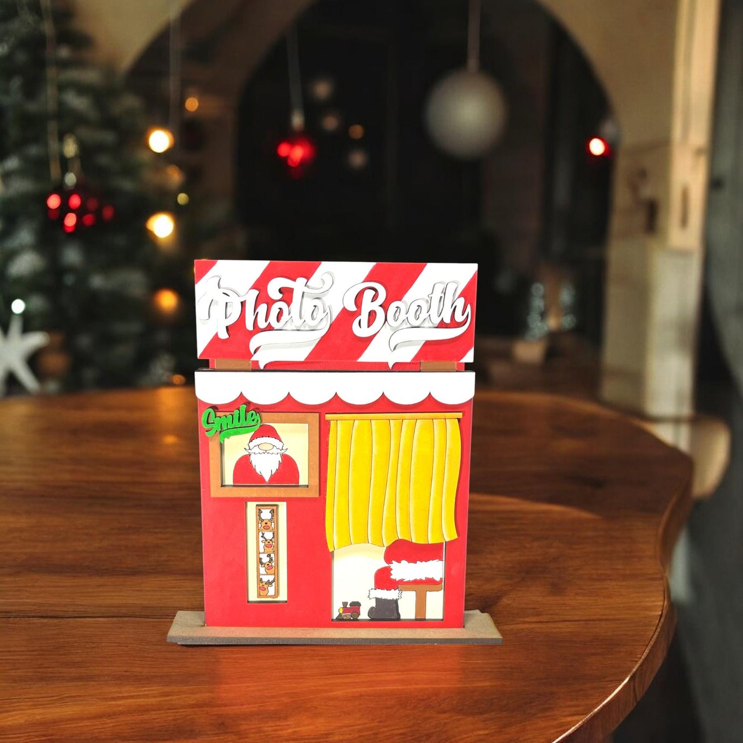 a small toy house sitting on top of a wooden table