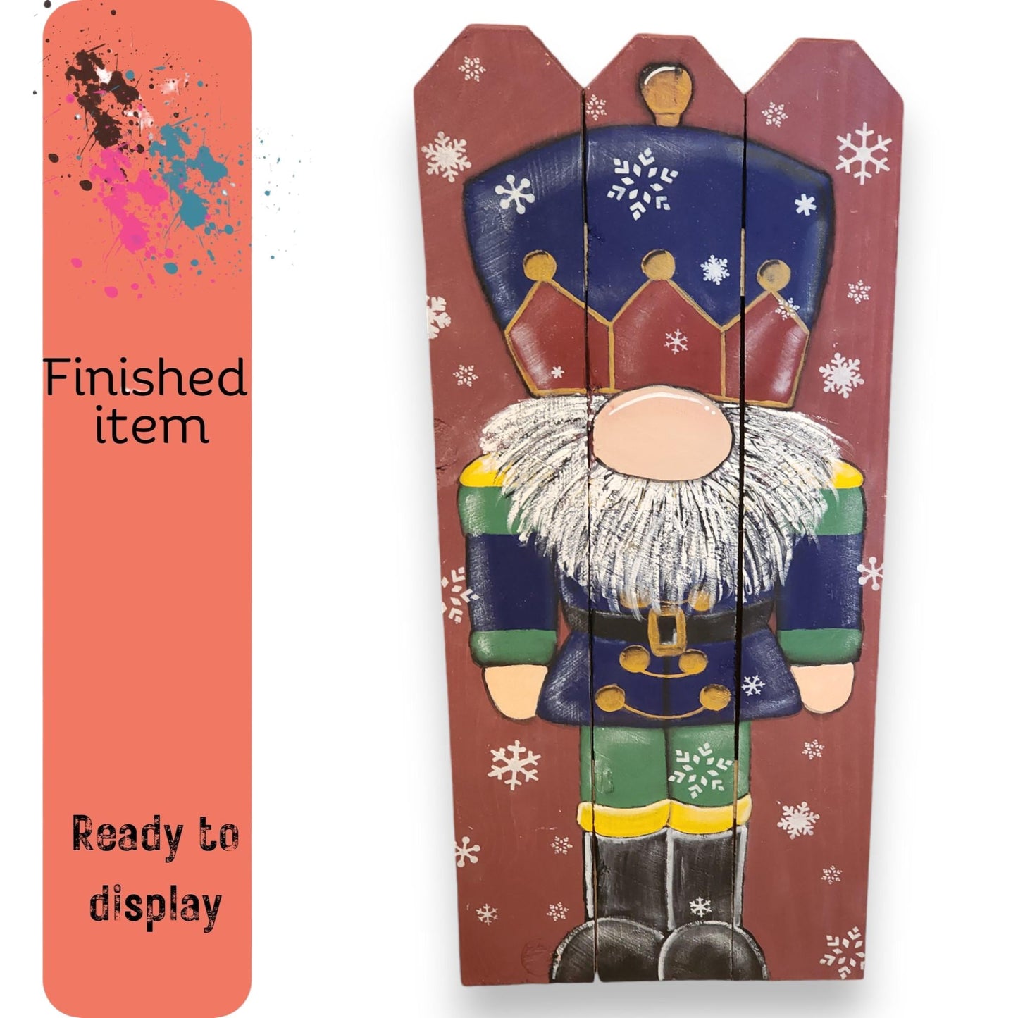 a wooden sign with a picture of a nutcracker