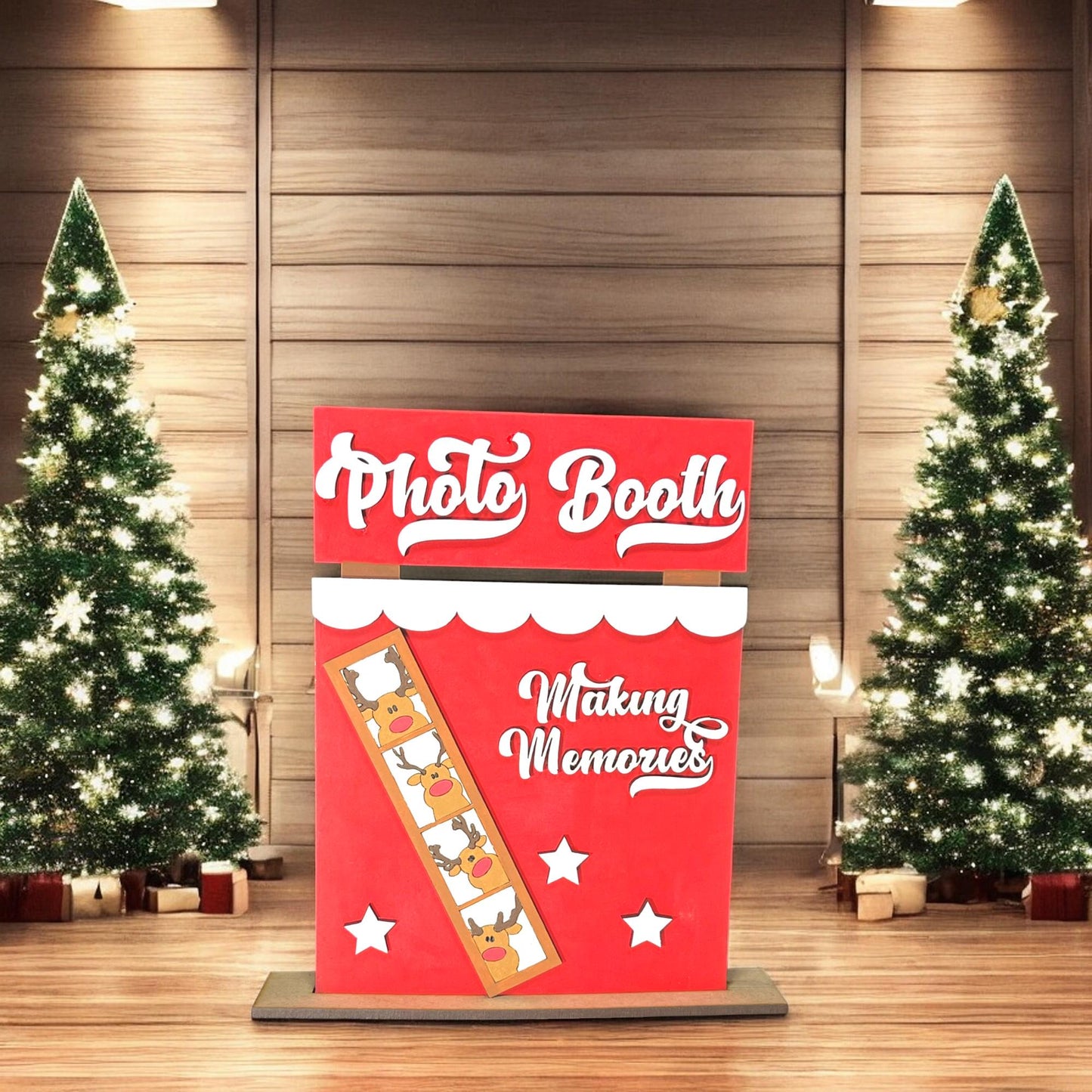 a photo booth with christmas trees in the background