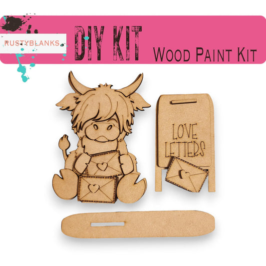 a wooden craft kit with a picture of a cow