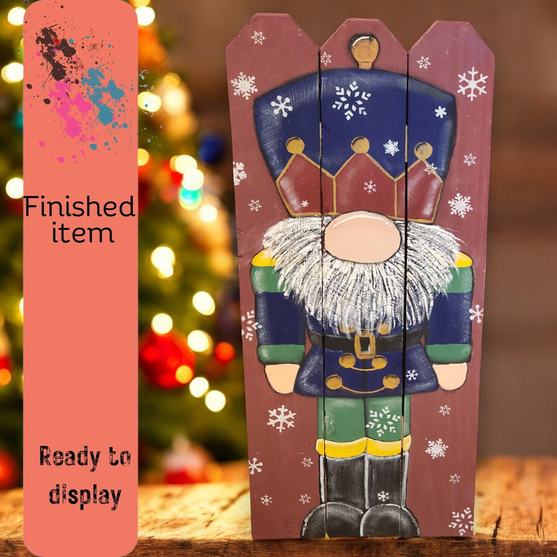 a wooden christmas decoration with a picture of a nutcracker