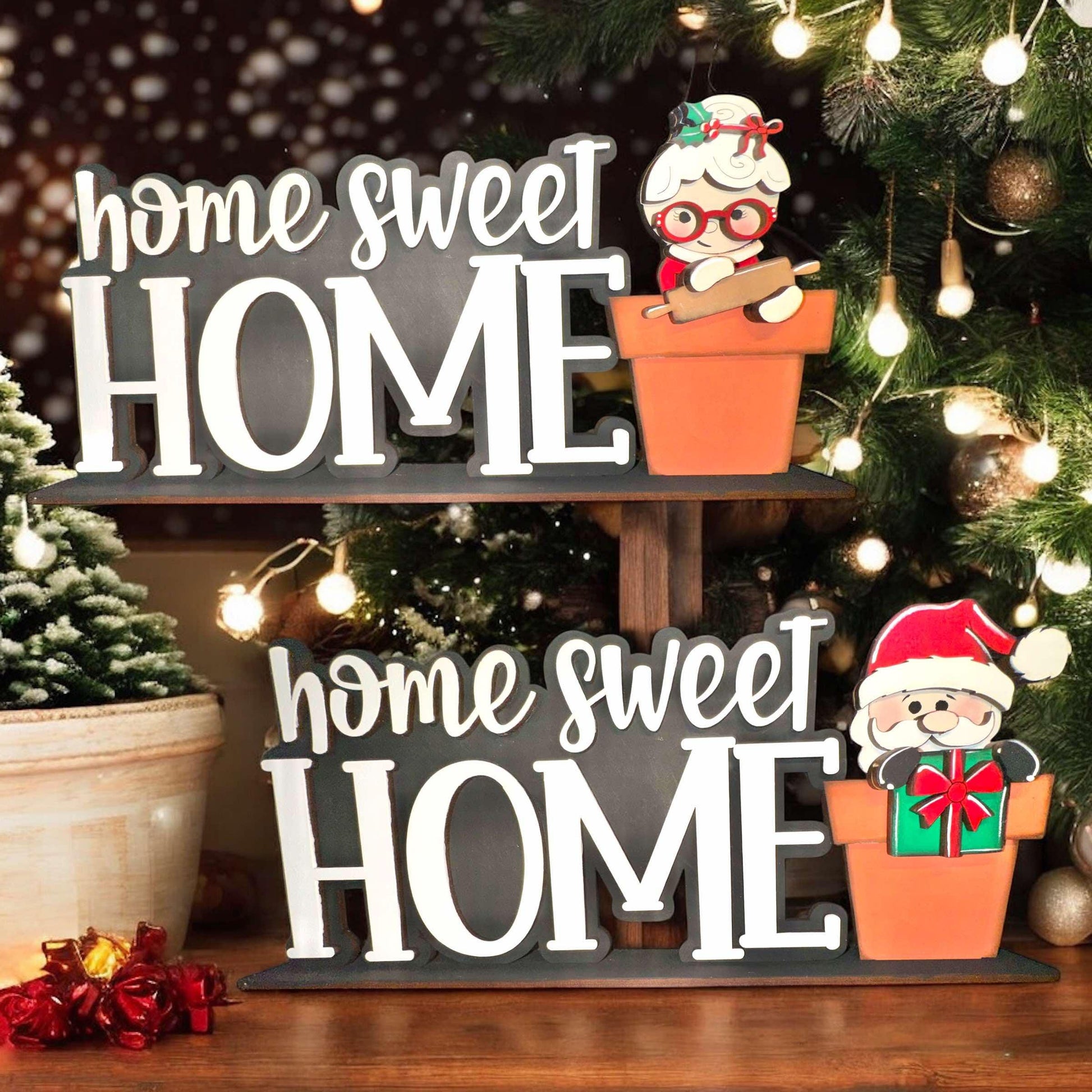 a christmas tree with a sign that says home sweet home