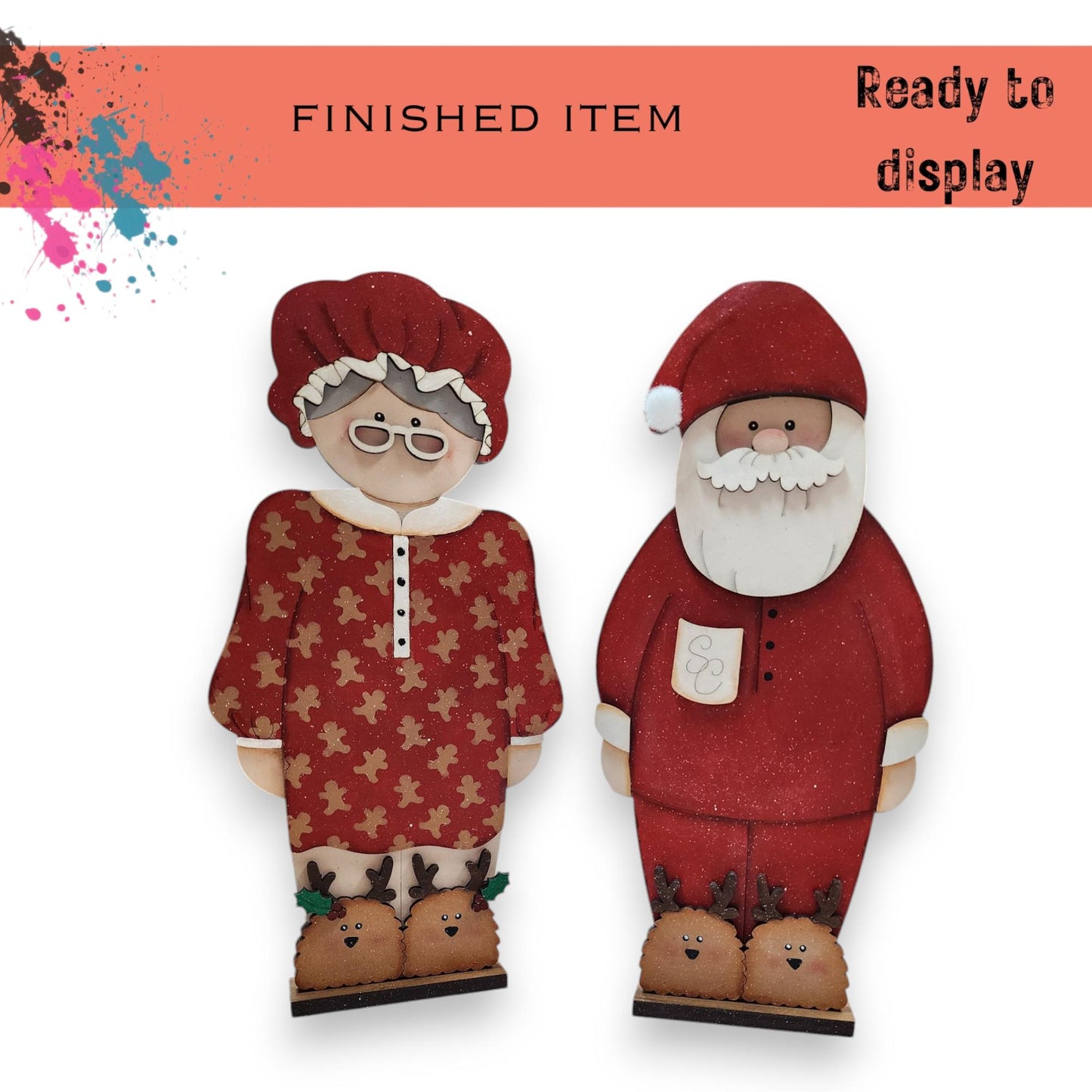 a pair of paper dolls of santa claus and mrs claus