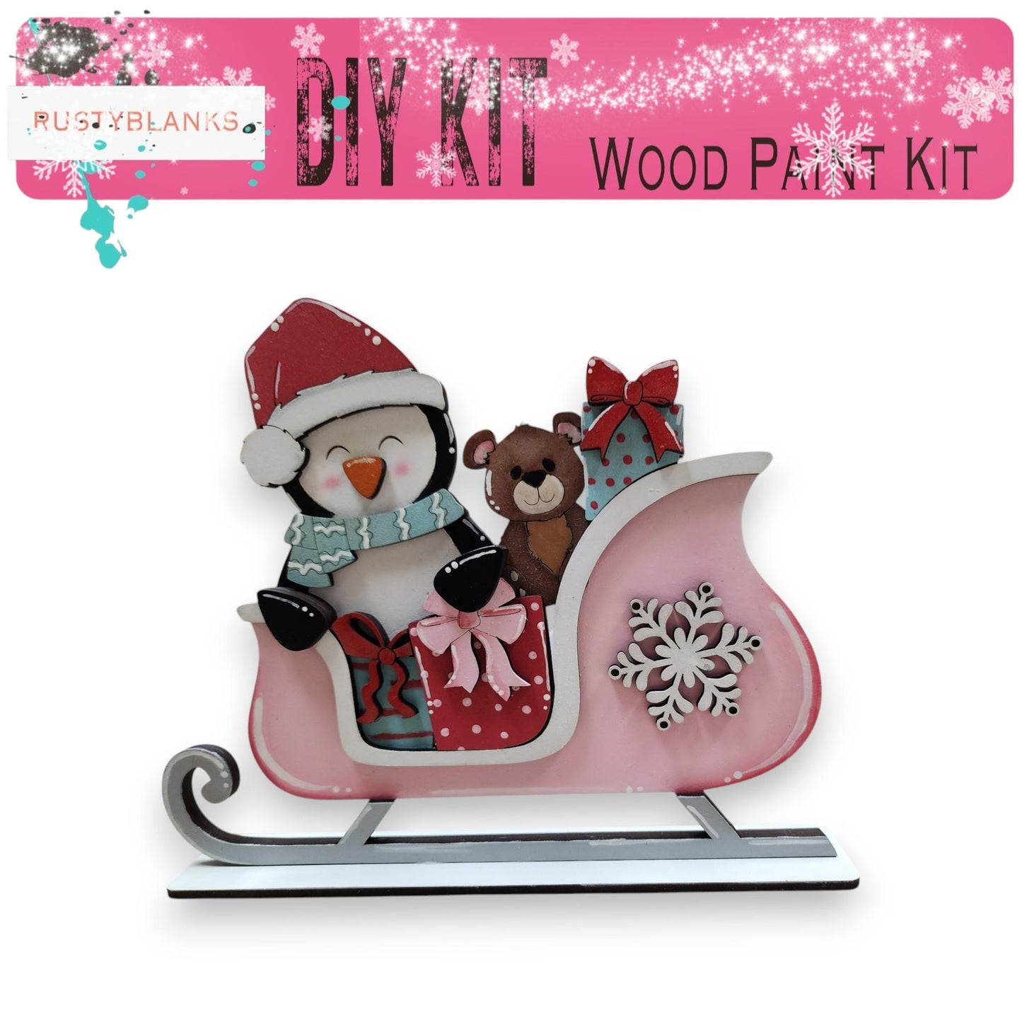 a pink snow sleigh with a penguin and a teddy bear