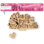 a wooden cutout of a dog with a heart