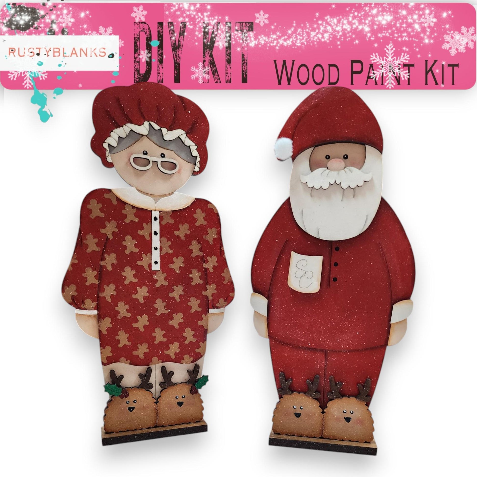 a couple of paper cut outs of santa and mrs claus