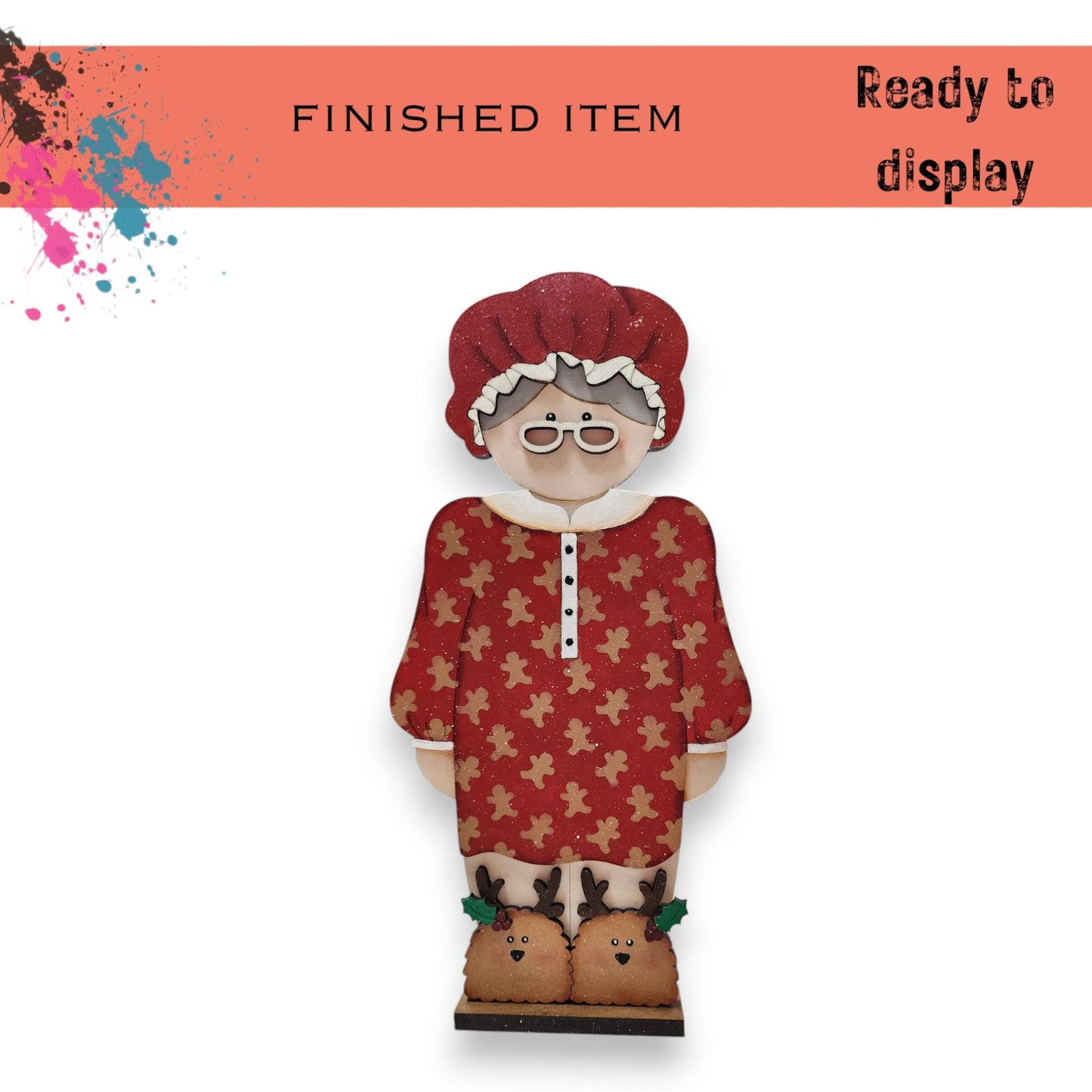 a paper doll with a red hat and glasses