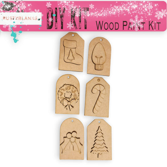 a set of wooden tags with christmas designs