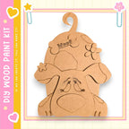 A wooden dog-shaped figure with a wagging tail and flower decorations, set against a pink and yellow background with a heart and star motif.